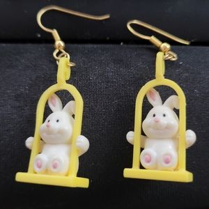 Vintage Russ Rabbit earring on a yellow swing